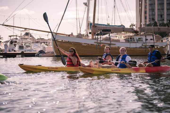 a group of people on a boat in the water