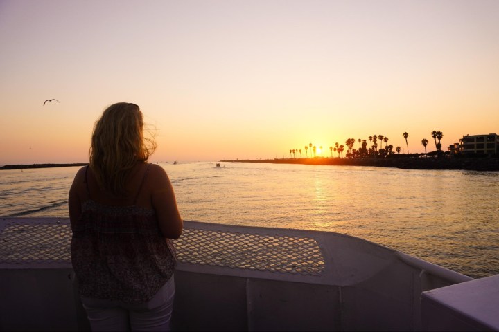 a person standing in front of a body of water
