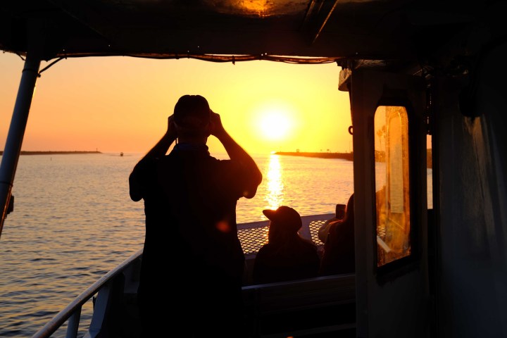 a sunset over a body of water
