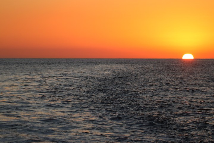a sunset over a body of water